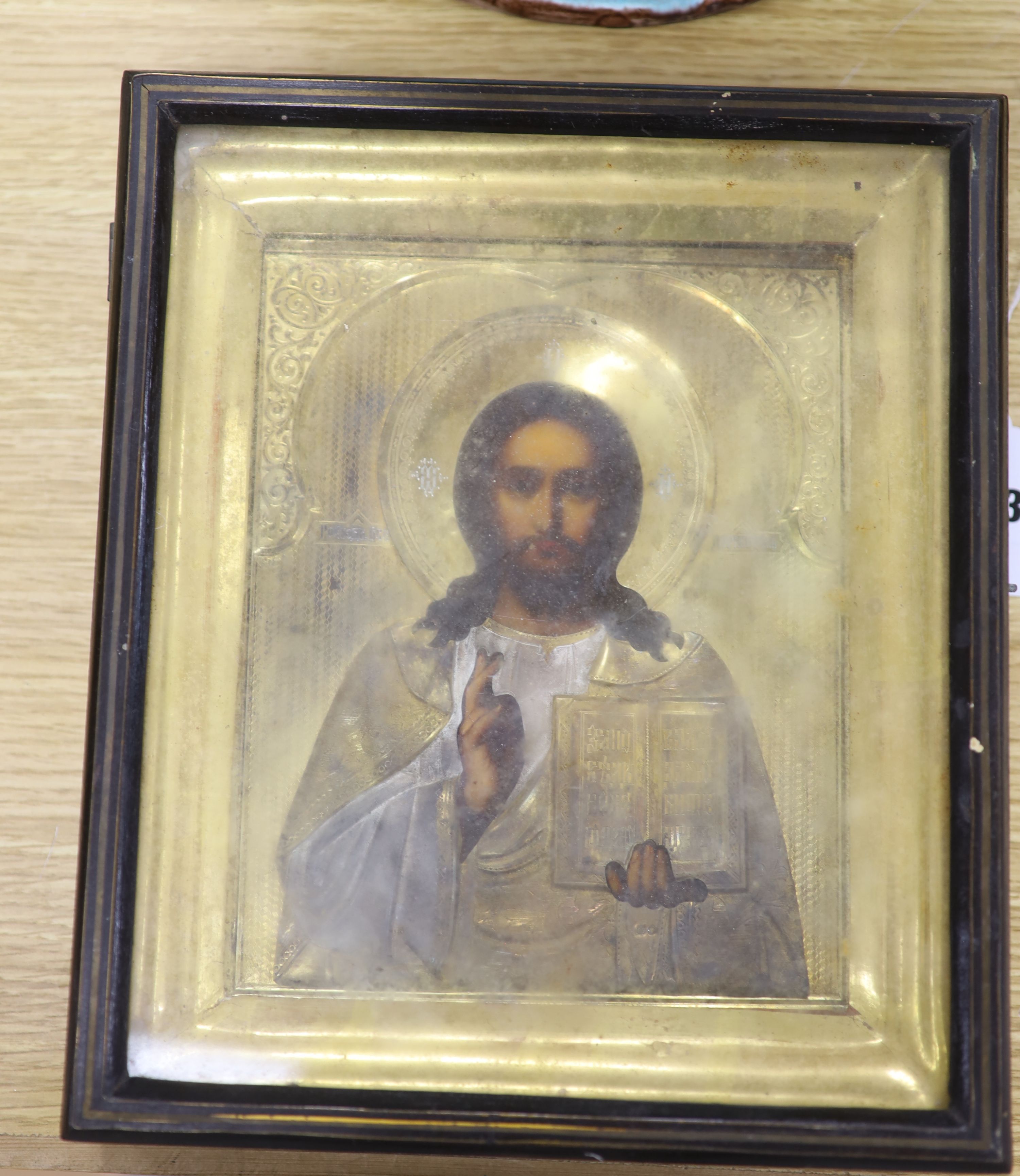 19th century Russian School, tempera on panel, Icon of Christ Pantocrator, with gilt oklad, 22 x 18cm, overall 29 x 25cm